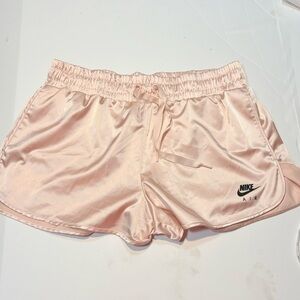 pair of Nike Sportswear Air Satin Shorts pink tracksuit-inspired shorts xl